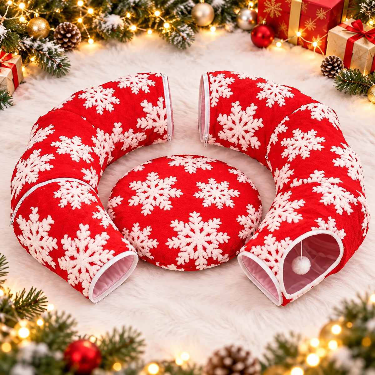 Two red snowflake cat tunnel sections with a separate circular bed cushion