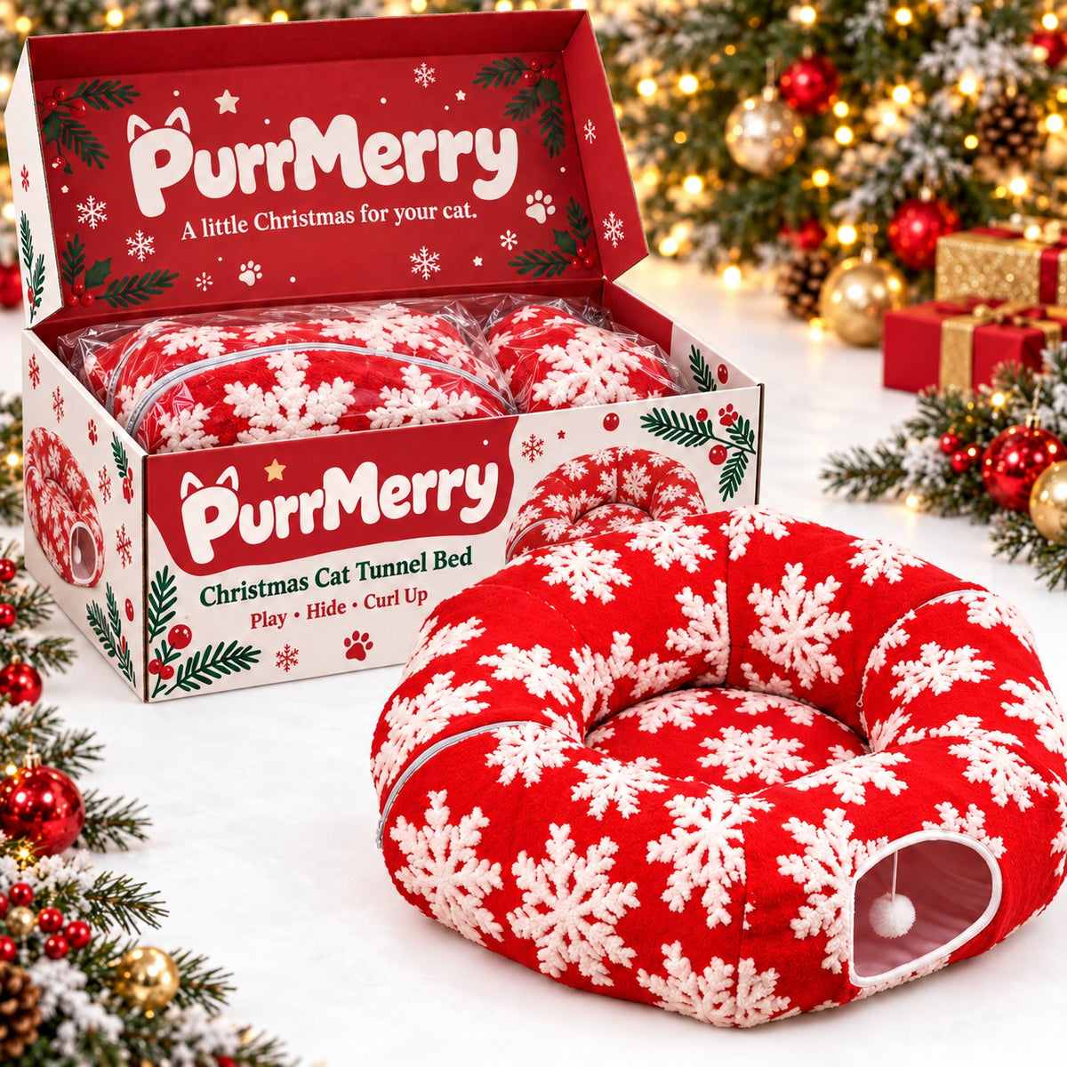 PurrMerry red Christmas cat tunnel bed beside an open festive gift box with the folded tunnel inside