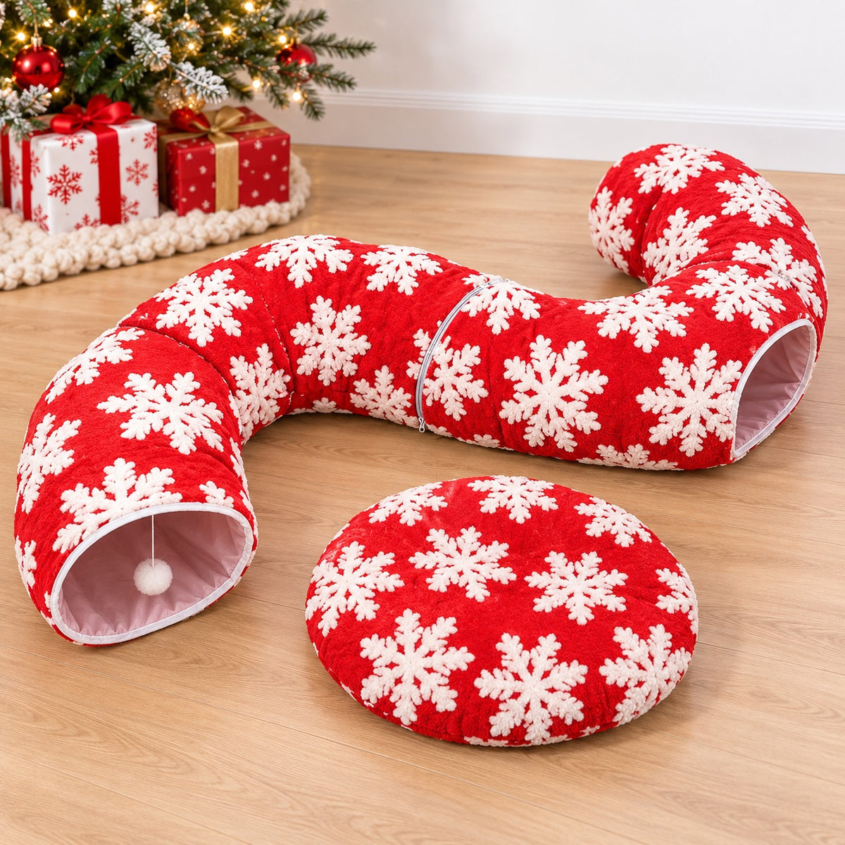Red Christmas cat tunnel arranged in an S shape beside its matching cushion